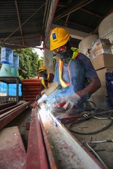 Metal fabrication workers in a workshop